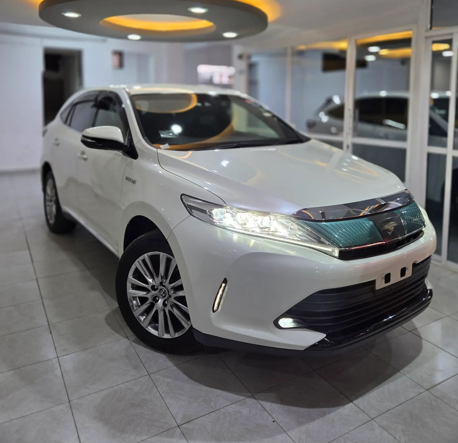 Pearl White Toyota Harrier Hybrid 2018 4WD Premium Grade for sale in Kenya, featuring a Red Leather Interior, Auto Boot, and Xenon Lights at Mundiya International.