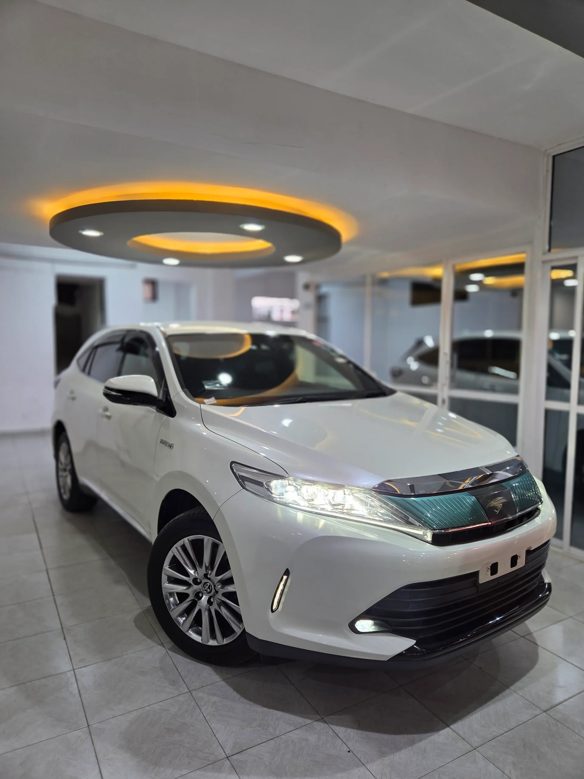 Pearl White Toyota Harrier Hybrid 2018 4WD Premium Grade for sale in Kenya, featuring a Red Leather Interior, Auto Boot, and Xenon Lights at Mundiya International.