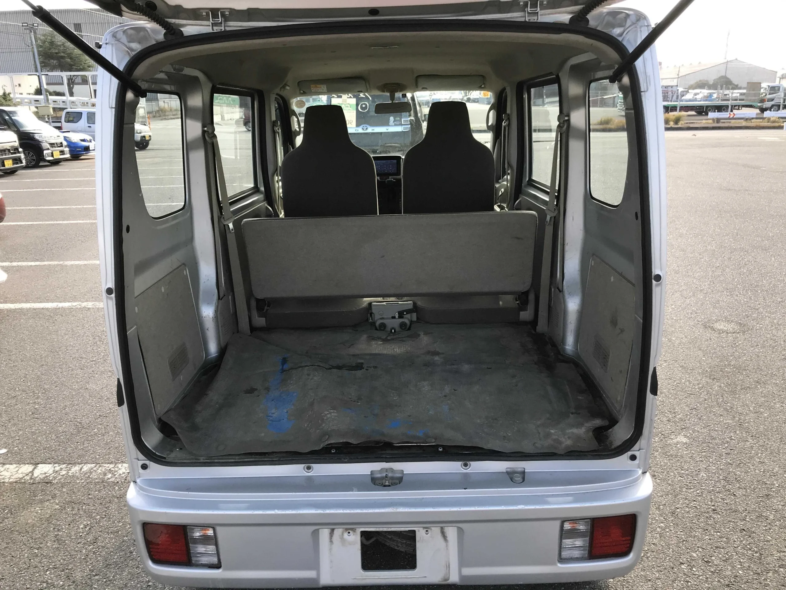 Flat cargo space of the silver Suzuki Every 2019 showing the massive storage capacity for Kenyan businesses.