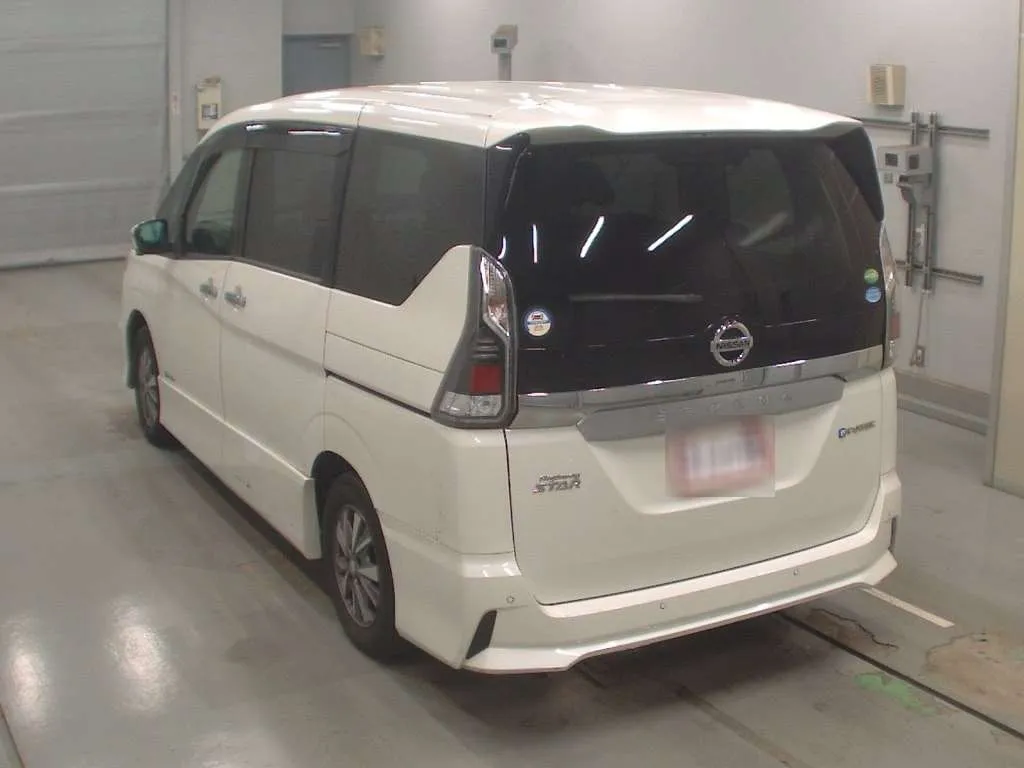 Modern Pearl White Nissan Serena 2019 showing the dual-opening tailgate and e-Power branding for sale in Nairobi.