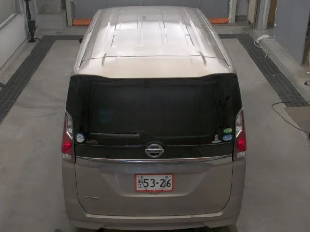 Sophisticated beige Nissan Serena 2019 MPV showing its dual sliding doors, alloy rims, and sleek station wagon profile for sale in Nairobi.