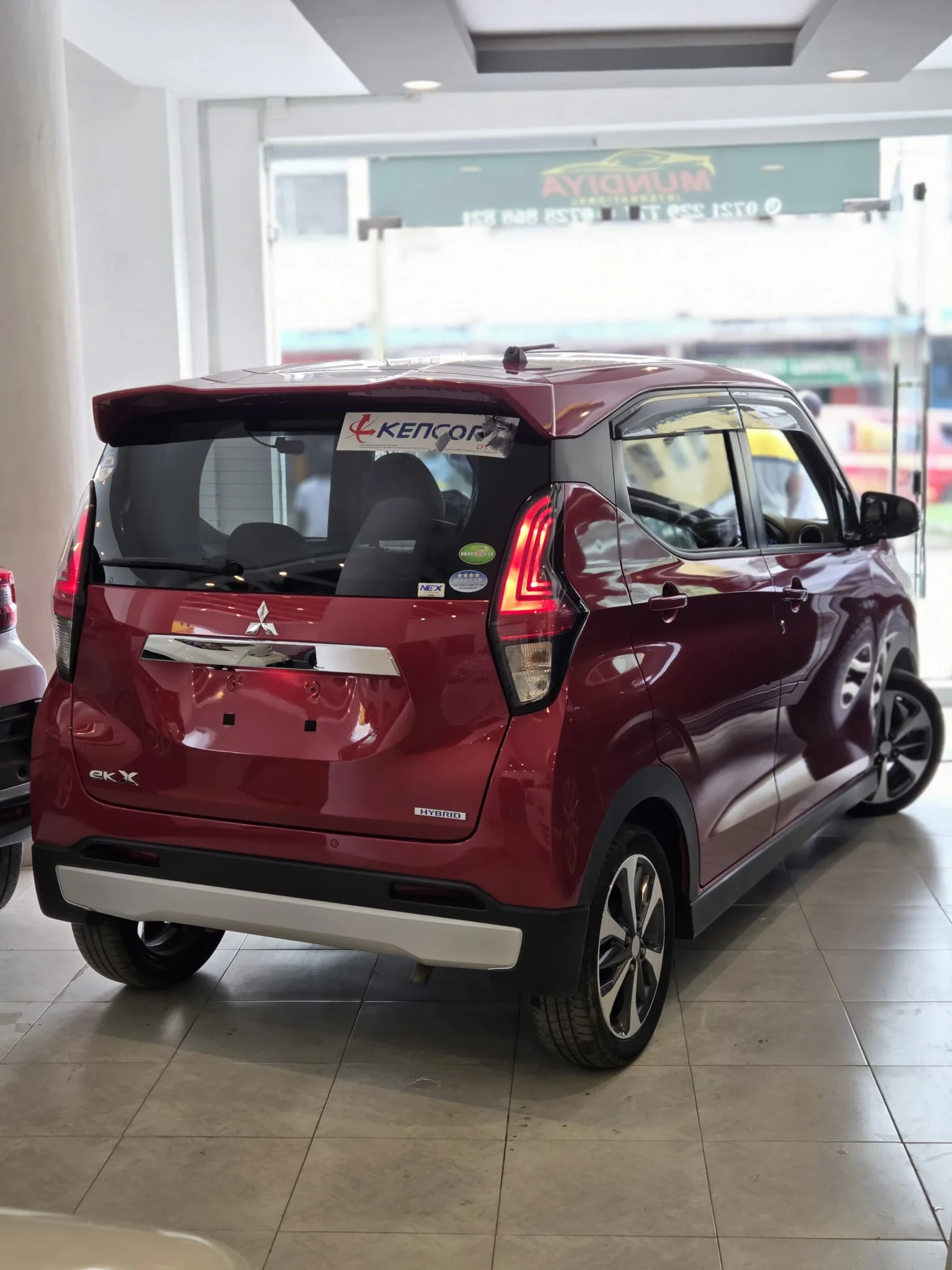 Rugged red Mitsubishi eK X 2019 crossover showing its SUV-style wheel arches, factory alloy rims, and modern New Shape silhouette for sale in Nairobi.